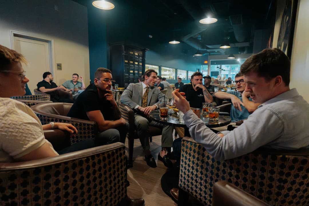 Conversation over cocktails at a Conduit event